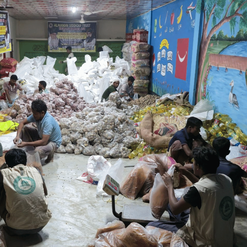 Woman in hijab holding a donation box